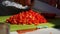 Housewife chopping red peppers before cooking