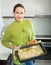 Housewife cooking filleted fish