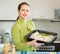 Housewife cooking filleted fish