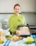 Housewife cooking filleted fish