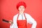 Housewife with cooking knife. professional chef in kitchen. Cuisine. butcher cut meat. woman in cook hat and apron