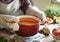 A housewife cooking tomato sauce