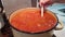 housewife cooks vegetable soup in a large pot