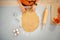 Housewife cutting out biscuits for Halloween party. Closeup