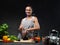 Housewife female chef cook standing next to a table in kitchen