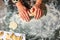 The housewife hands knead the dough for making dumplings in Ukrainian national cuisine