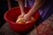 Housewife kneading the dough by hand. preparation of the recipe for traditional Romanian homemade cakes known as cozonac