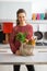 Housewife with local market purchases in kitchen