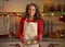 Housewife with pan of fresh cookies in kitchen