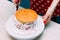 Housewife prepares sponge cake in the kitchen. Close-up. Woman`s hands