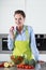 Housewife preparing salad with tomatoes