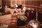 Housewife`s hands putting burlap on the lid of a jar with freshly made jam and tying bow with a rope while preparing homemade