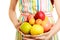 Housewife or seller offering healthy fruits isolated