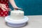 Housewife Shapes Sponge Cake. Woman hands