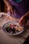 Housewife slicing Turkish delicacies into small cubes on a plate