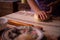 The housewife spreading the dough with a rolling pin. preparation of homemade cakes