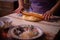 The housewife spreading the dough with a rolling pin. preparation of homemade cakes