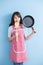 Housewife take wok and spoon
