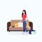 Housewife using vacuum cleaner girl vacuuming couch doing housework housekeeping cleaning service concept full length