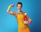 Housewife with washed plates and dish soap showing biceps