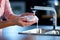 Housewifes hands in action, tackling post dinner cleanup with a detergent soaked sponge