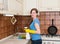 Housework and housekeeping concept. Young woman with cleaning sp