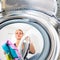 Housework: young woman doing laundry