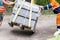 Housing and communal services workers perform work on unloading heavy concrete blocks