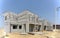 Housing property construction progress, people are building a precast house, the workman working in front the house in a hot day