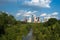 Houston city skyline behind green park with river