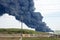 HOUSTON â€” A fire at a Houston-area petroch Petrochemical Fire. A plume of smoke rises from a petrochemical fire at the