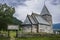 Hove church, an old stone church in Vikoyri, Norway, during a moody, dramtic day