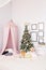 Hovel prepared for children. Beautiful New Year decor of the children room Christmas house.