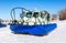 Hovercraft transporter on the ice of river in winter
