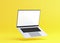 Hovering aluminium flying laptop with blank screen new design on yellow background, modern computer monitor closeup flying