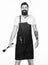 How choose meat for steak. Professional barbecue utensil. Bearded hipster wear apron for barbecue. Roasting and grilling