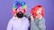 How crazy is your father. Man bearded father and girl wear colorful wig while eat lollipop candy. Thing loving father do