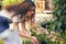 How are we doing today. a young female florist planting flowers.