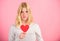 How to fight valentines day loneliness. Girl hold heart love symbol over pink background. Valentines day concept. How to