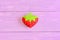 How to hand sew a children toy strawberry. Step. Tutorial. Kids felt toy strawberry on purple wooden background