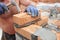 How to lay bricks: Bricklayer laying bricks with hammer. Masonry Construction.