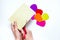 How to make a flower at home from colored paper. Hands make a colorful flower out of paper. Step 3. With scissors cut