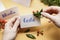 How to make wedding place name cards with handwritten letters and fresh plants