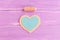 How to sew a felt heart decor. Step. Join blue and beige felt pieces using beige thread. Sewing kit on wooden background