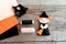 How to sew a Halloween witch doll. Step. Halloween witch decor, scissors, thread, needle, felt sheets on wooden background