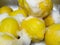 How to wash lemons? Juicy ripe yellow lemons covered with white soap foam. Healthy tropical fruit rich of vitamin C.
