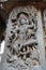 Hoysaleshwara Temple wall carving of lord shiva dancing on top of a demon