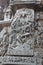 Hoysaleswara Temple outside wall carved with sculpture of lord shiva dancing on top of a demon