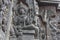 Hoysaleswara Temple wall carved with sculpture of Ishana hindu male god holding pine cone in his hands