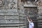 Hoysaleswara Temple wall carved with a sculpture looking like foreigner